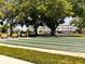 Recreational shuffleboard courts with shaded benches offer a fun and engaging outdoor community activity at 2021 Shangrila Dr # 14, Clearwater, FL 33763