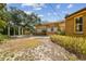 View of the backyard showcasing the pool, pergola and large trees at 2710 N Dundee St, Tampa, FL 33629