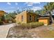 Exterior view of the brick structure with a brick pathway and lush greenery at 2710 N Dundee St, Tampa, FL 33629