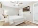 Bedroom featuring neutral decor, a ceiling fan, tv and light-colored carpet at 27343 Warner Ave, Brooksville, FL 34602