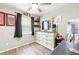 Bedroom features a large window, dark drapes, a ceiling fan and a dresser at 27343 Warner Ave, Brooksville, FL 34602