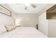 This bedroom has carpeted floors, a ceiling fan, and a view of the closet at 27343 Warner Ave, Brooksville, FL 34602