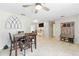 Open dining area with a wooden table, seating for four, and an open floor plan at 27343 Warner Ave, Brooksville, FL 34602