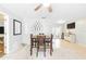 Dining room with tile floors, a wooden table, and plenty of natural light at 27343 Warner Ave, Brooksville, FL 34602