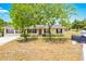 Inviting single-story home with manicured landscaping and classic curb appeal at 27343 Warner Ave, Brooksville, FL 34602