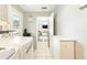 The laundry room leads to the kitchen, and it features a washer and dryer at 27343 Warner Ave, Brooksville, FL 34602