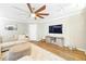Cozy living room featuring hardwood floors, an area rug, and a large sectional sofa at 27343 Warner Ave, Brooksville, FL 34602