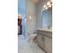 Bathroom featuring marble floors, neutral gray walls, and a closet at 2826 Riders Pass, Odessa, FL 33556