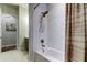 Neutral bathroom with stylish vanity, toilet, and shower-tub combo at 2826 Riders Pass, Odessa, FL 33556