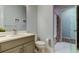 Neutral bathroom with modern fixtures, a combined shower and tub, and wood look floors at 2826 Riders Pass, Odessa, FL 33556