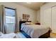 Bright bedroom featuring a large window, a twin bed, and closet at 2826 Riders Pass, Odessa, FL 33556