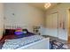 Bedroom featuring a bed, rug, and double door closet at 2826 Riders Pass, Odessa, FL 33556