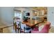 The dining room offers an open layout to the living room and kitchen with a hardwood table with seating for eight at 2826 Riders Pass, Odessa, FL 33556