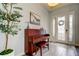 Bright entryway featuring wood-look tile floors and decorative front door at 2826 Riders Pass, Odessa, FL 33556