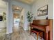 Elegant foyer with a piano and view of the living area at 2826 Riders Pass, Odessa, FL 33556
