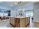 Open concept kitchen with a large island, stainless steel appliances, and ample counter space at 2826 Riders Pass, Odessa, FL 33556