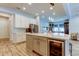 Kitchen featuring a large island with a wine fridge and stainless steel appliances at 2826 Riders Pass, Odessa, FL 33556
