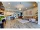 Open-concept living room seamlessly connects to the kitchen and dining area, perfect for entertaining at 2826 Riders Pass, Odessa, FL 33556