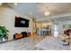 Bright, open-concept living room with modern finishes and beautiful flooring at 2826 Riders Pass, Odessa, FL 33556