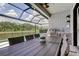 Outdoor kitchen with a view of the pool and greenspace at 2826 Riders Pass, Odessa, FL 33556