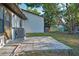 Backyard featuring a concrete patio area and lush green lawn, ideal for outdoor enjoyment at 2945 Grovewood Blvd # D, Palm Harbor, FL 34683