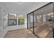 Sun room featuring wood floor and windows at 2945 Grovewood Blvd # D, Palm Harbor, FL 34683