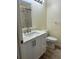 Bathroom features a white vanity with a modern sink and faucet, a toilet, and a shower at 3086 Pointer Dr, Palm Harbor, FL 34683
