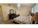 Cozy bedroom with wood floors, ceiling fan, and pleasant natural light at 3086 Pointer Dr, Palm Harbor, FL 34683