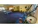 Community gym featuring elliptical machine, ping pong table and plenty of space for activities at 3086 Pointer Dr, Palm Harbor, FL 34683