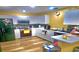 Functional kitchen with white cabinets, modern appliances, and hardwood floors at 3086 Pointer Dr, Palm Harbor, FL 34683