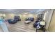 Bright living room with wood floors, recessed lights, ample seating, and a china cabinet adding elegance at 3086 Pointer Dr, Palm Harbor, FL 34683