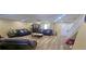 Open-concept living area with wood floors, recessed lighting, offering ample space for relaxation and entertainment at 3086 Pointer Dr, Palm Harbor, FL 34683