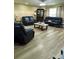 Inviting living room featuring wood floors, recessed lights, and comfortable seating for relaxation at 3086 Pointer Dr, Palm Harbor, FL 34683