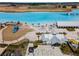 The community features a white sandy beach, clear blue lagoon with inflatables, and a restaurant at 31354 Cabana Rye Ave, San Antonio, FL 33576