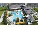 Overhead view of a resort-style pool, clubhouse and palm trees within the community at 31354 Cabana Rye Ave, San Antonio, FL 33576