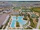 Stunning aerial view of the community pool, clubhouse, tennis courts, bocce ball and shuffleboard courts at 31354 Cabana Rye Ave, San Antonio, FL 33576