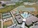 An aerial view shows the resort-style amenities, including a pool and tennis courts at 31354 Cabana Rye Ave, San Antonio, FL 33576