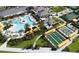 Beautiful aerial view of the community pool, bocce ball courts, shuffleboard courts, and tropical landscaping at 31354 Cabana Rye Ave, San Antonio, FL 33576