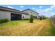Large backyard of home, with well manicured lawn and view of the screened-in porch at 31354 Cabana Rye Ave, San Antonio, FL 33576