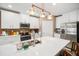 Modern kitchen featuring an island with a sink, stainless steel appliances, and pendant lighting at 31354 Cabana Rye Ave, San Antonio, FL 33576
