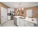 Open kitchen with a large island, stainless steel appliances, and ample cabinet space for storage at 31354 Cabana Rye Ave, San Antonio, FL 33576