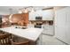 Bright kitchen featuring a large island with quartz countertops, stainless steel appliances, and white cabinets at 31354 Cabana Rye Ave, San Antonio, FL 33576