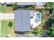 Aerial view of home with a pool, spa, patio, driveway, and landscaping at 320 Crosswinds Dr, Palm Harbor, FL 34683