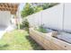 Backyard view featuring a garden box with a white fence for added privacy at 320 Crosswinds Dr, Palm Harbor, FL 34683