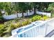 An outdoor pool and backyard with lush greenery, as seen from above at 320 Crosswinds Dr, Palm Harbor, FL 34683