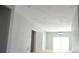 Spacious bedroom with new floors, fresh paint, and sliding glass door at 320 Crosswinds Dr, Palm Harbor, FL 34683