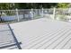 Spacious deck with a gray finish and white railings at 320 Crosswinds Dr, Palm Harbor, FL 34683