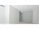 Empty room featuring light walls and light colored floors with bright lighting at 320 Crosswinds Dr, Palm Harbor, FL 34683