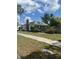 Quaint single-Gathering home with a charming front door and a manicured lawn with a gorgeous curb appeal at 3210 W North B St, Tampa, FL 33609
