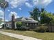Quaint single-story home featuring a red brick chimney, well-maintained lawn, and charming curb appeal at 3210 W North B St, Tampa, FL 33609